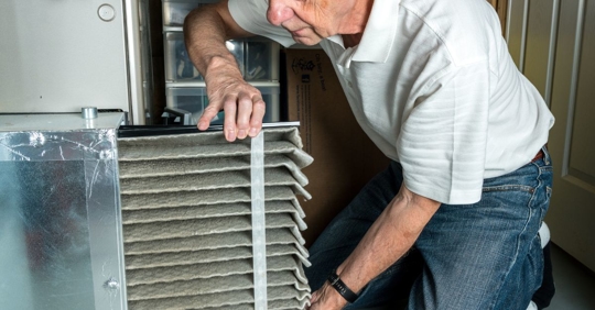 Man changing air filter