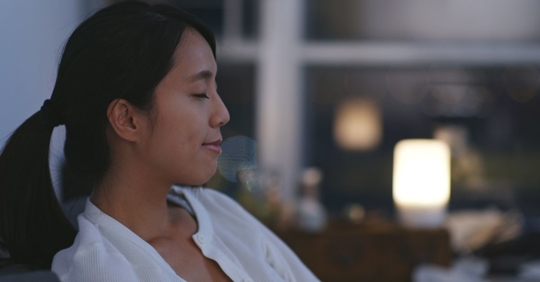 woman taking deep breath