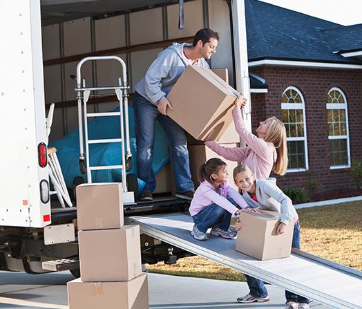 Family grabs boxes for move